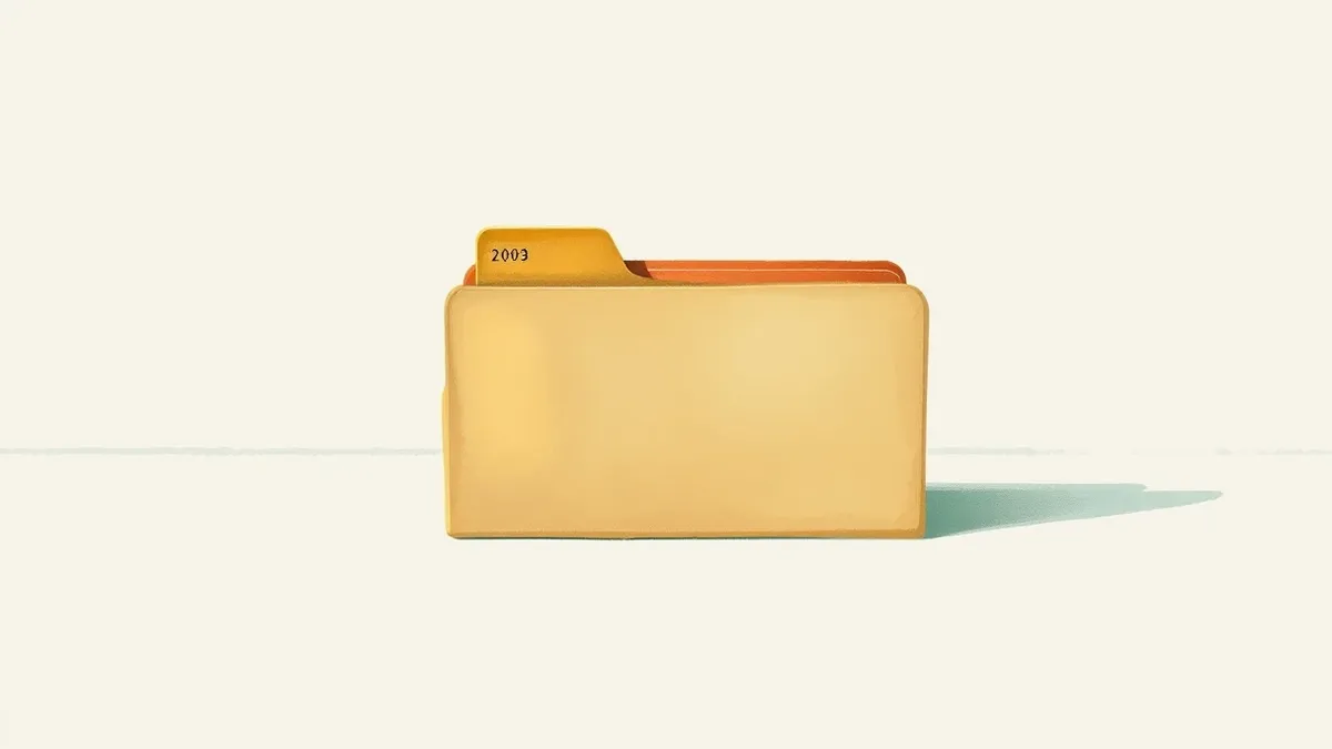 Illustration: A small, generic file folder icon sits open on a plain white desk surface.
